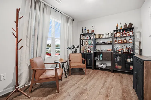 a room with furniture and a book shelf