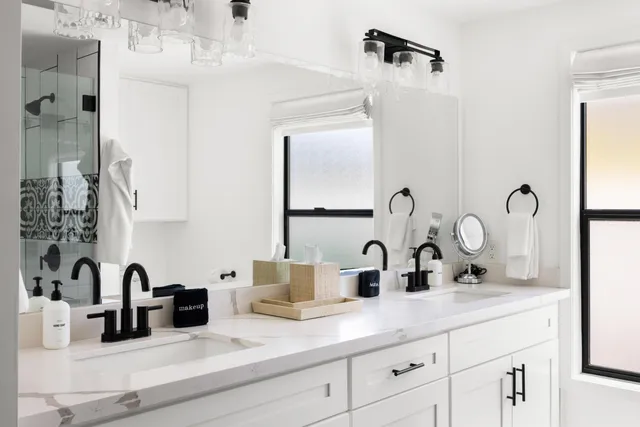 a bathroom with sink and mirror