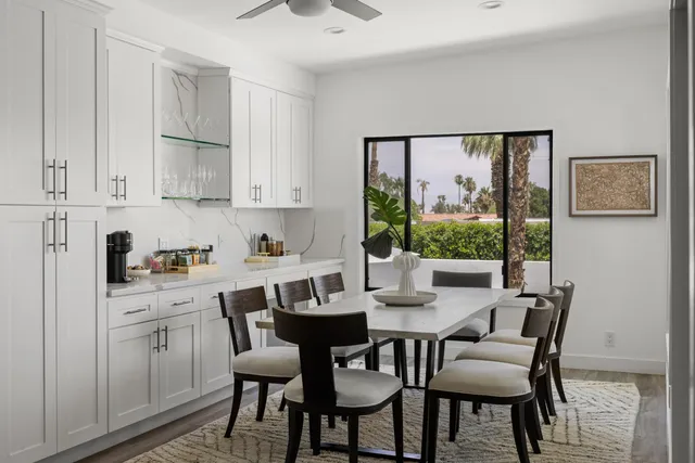 a view of a dining room with furniture window and outside view