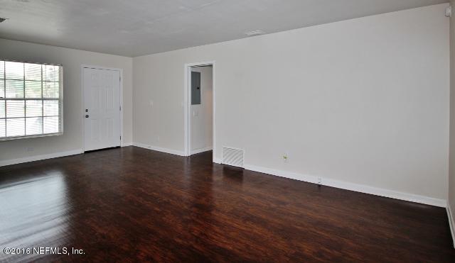 6328 Merrill Road Jacksonville, FL 32277 - Photo 2 of 10 a view of wooden floor and windows in a room