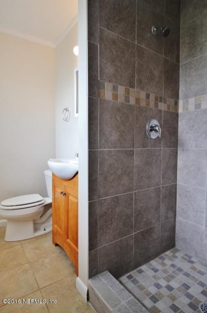 6328 Merrill Road Jacksonville, FL 32277 - Photo 10 of 10 a bathroom with a toilet and a shower
