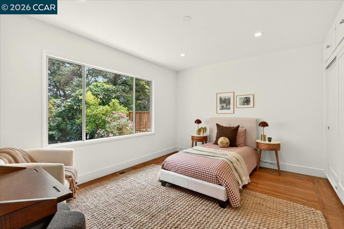 24 Las Vegas Road Orinda, CA 94563 - Photo 30 of 47 a bedroom with a bed and a couch