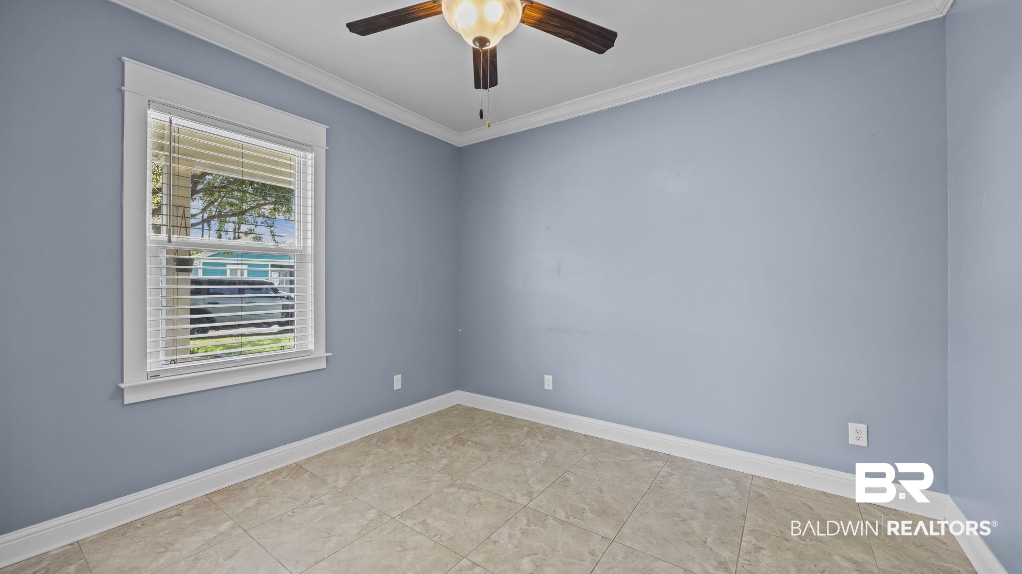 12361 Reunion Place Foley, AL 36535 - Photo 25 of 43 Empty room with crown molding and ceiling fan