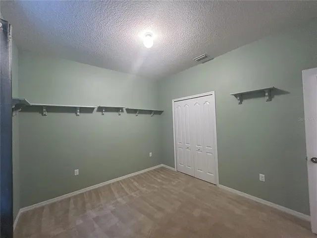 a view of empty room with windows