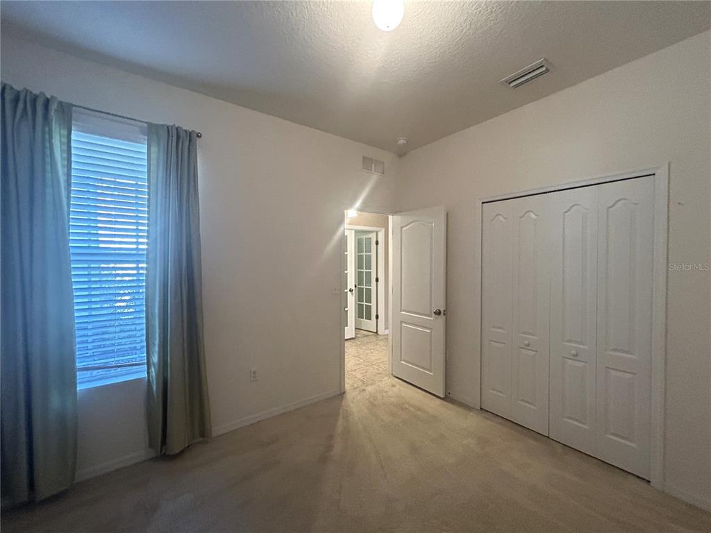 10702 Burning Bush Terrace Land O Lakes, FL 34638 - Photo 17 of 22 a view of empty room with windows