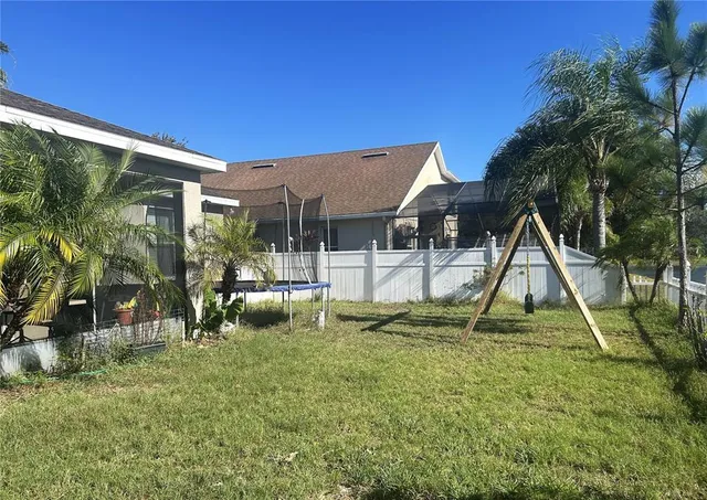 a view of playground with a slide and swing