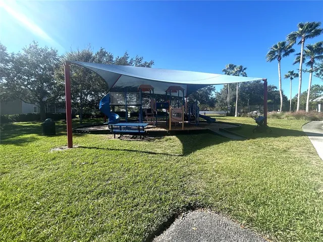 a view of a house with a yard porch and sitting area
