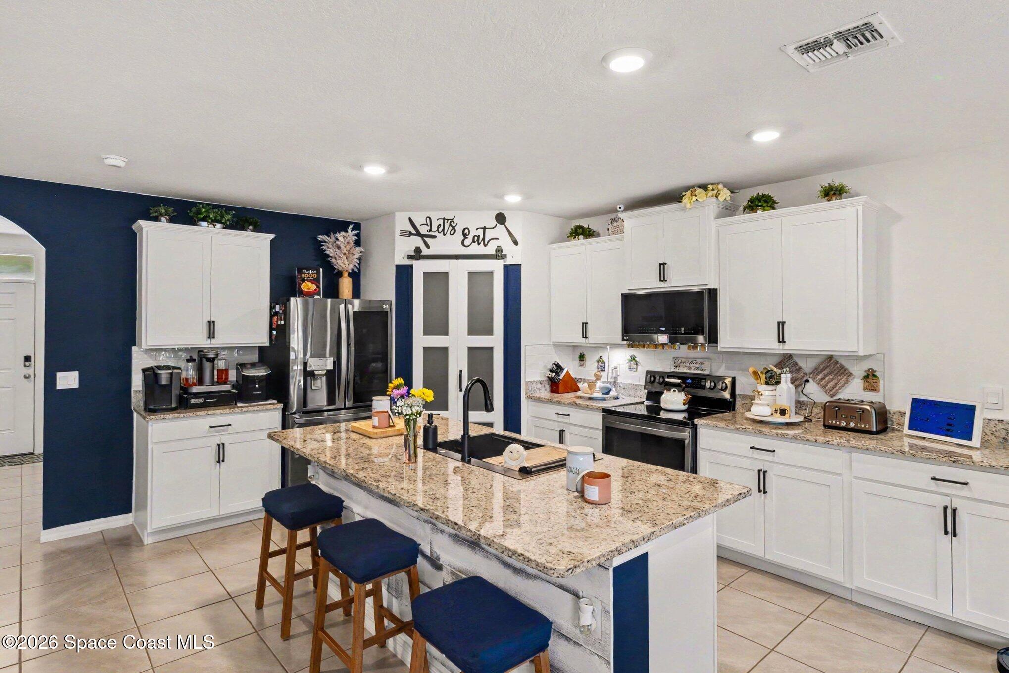 1873 Farmhouse Road Southeast Palm Bay, FL 32909 - Photo 5 of 35 5 bedroom 3 bath 2674 square feet home