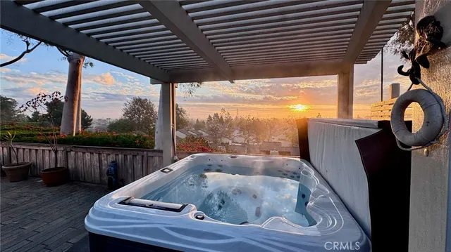 a wooden bench sitting in front of a building