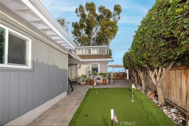 a view of an house with backyard porch and sitting area