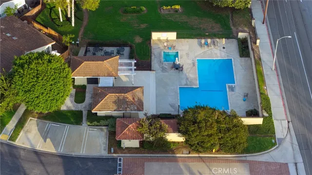 an aerial view of a house with garden space and street view