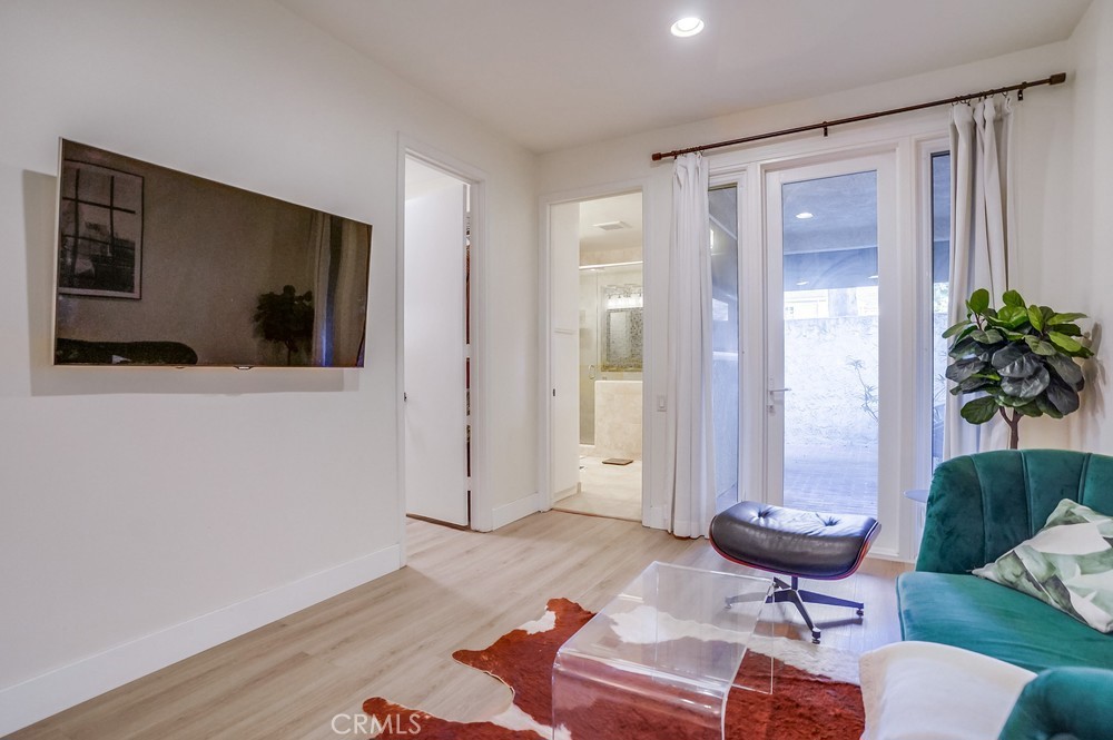 615 Edith Way Long Beach, CA 90807 - Photo 19 of 65 a living room with furniture and a flat screen tv