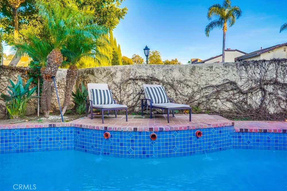 615 Edith Way Long Beach, CA 90807 - Photo 20 of 65 a park view with a bench and wooden fence