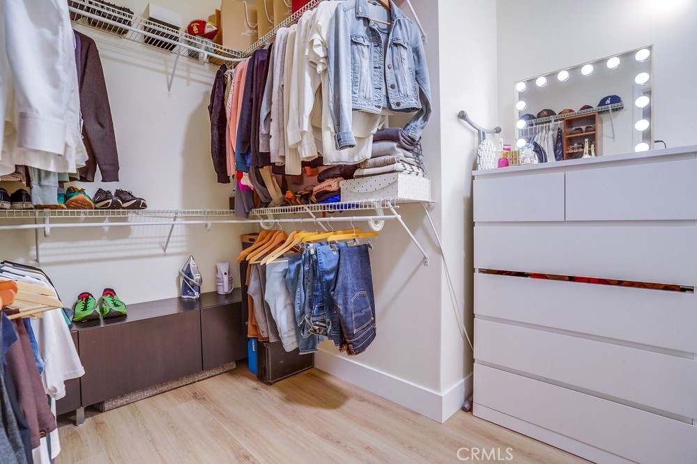 615 Edith Way Long Beach, CA 90807 - Photo 23 of 65 a view of walk in closet with clothes and shoes