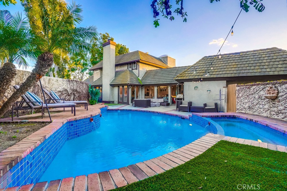 615 Edith Way Long Beach, CA 90807 - Photo 31 of 65 a view of a house with pool and sitting area