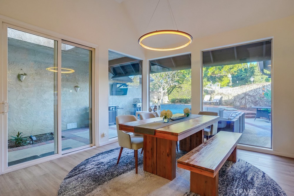 615 Edith Way Long Beach, CA 90807 - Photo 4 of 65 a dining room with a wooden table and chairs