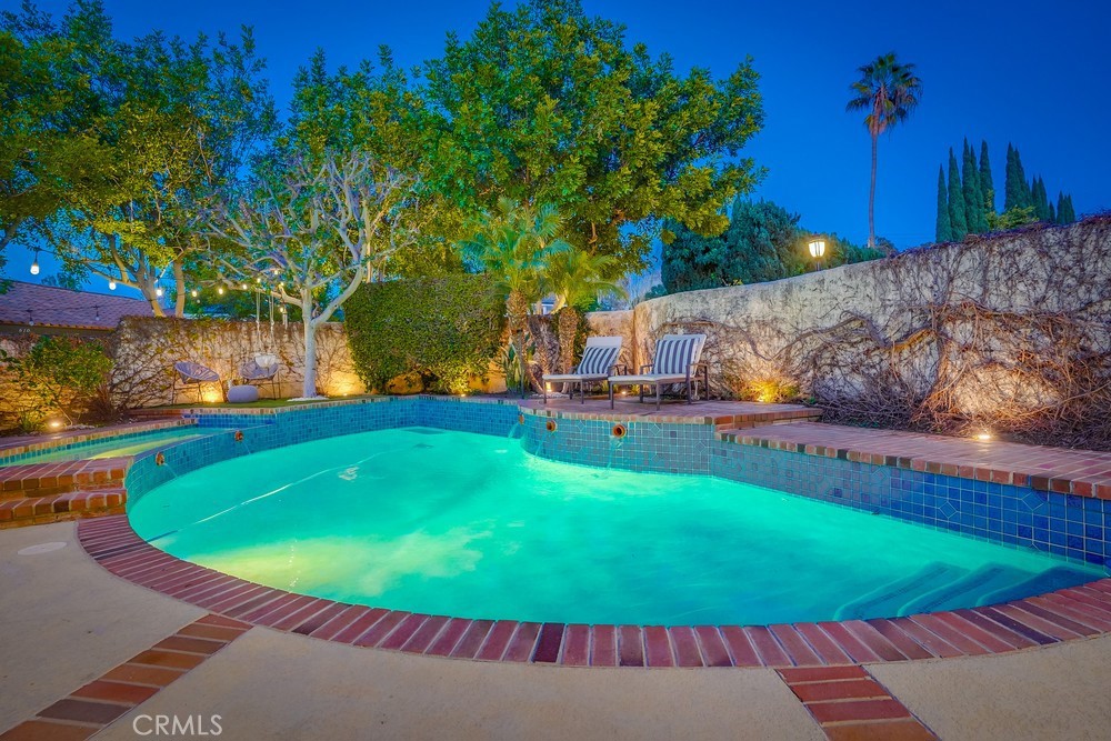 615 Edith Way Long Beach, CA 90807 - Photo 46 of 65 a view of a swimming pool with an outdoor seating