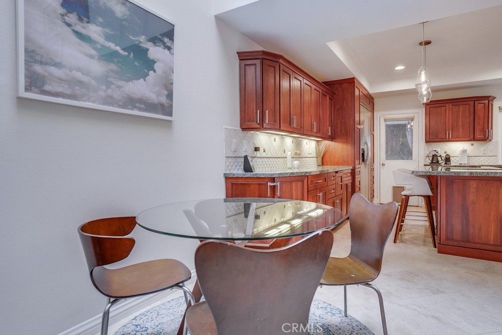 615 Edith Way Long Beach, CA 90807 - Photo 56 of 65 a table and chairs in a kitchen