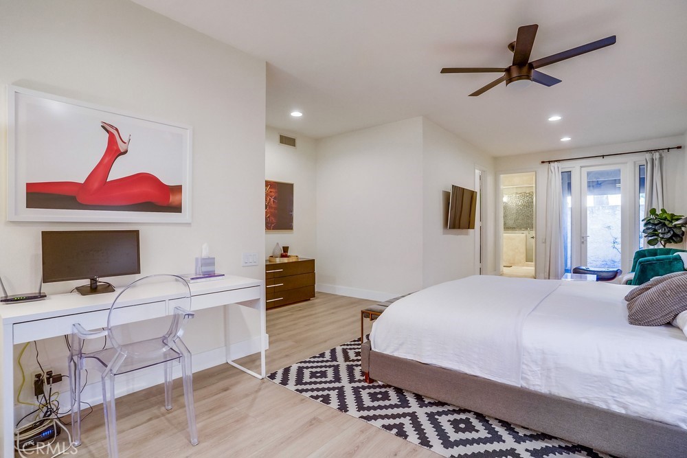 615 Edith Way Long Beach, CA 90807 - Photo 61 of 65 a bedroom with a bed a flat screen tv and a dresser