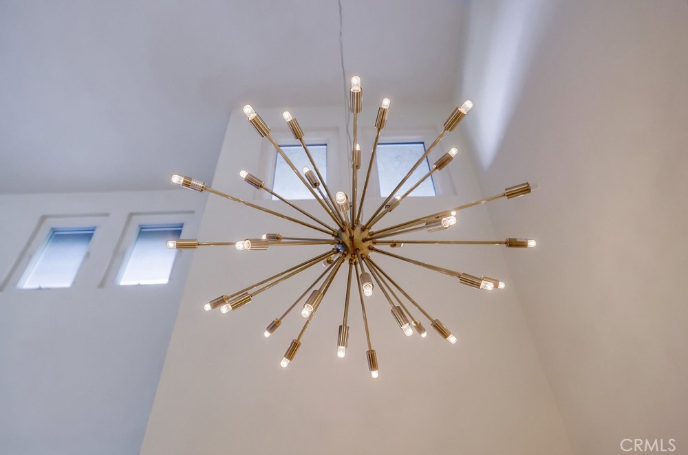 615 Edith Way Long Beach, CA 90807 - Photo 65 of 65 a view of a hallway with a chandelier