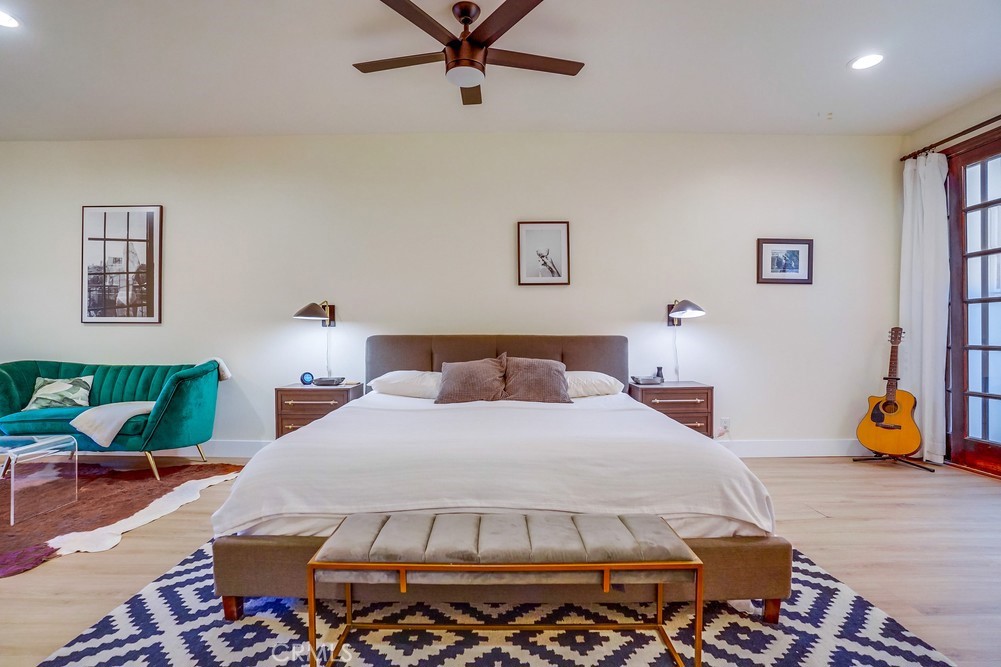 615 Edith Way Long Beach, CA 90807 - Photo 8 of 65 a bedroom with a bed a couch and a window