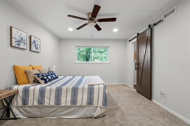 a bed room with a bed and a window