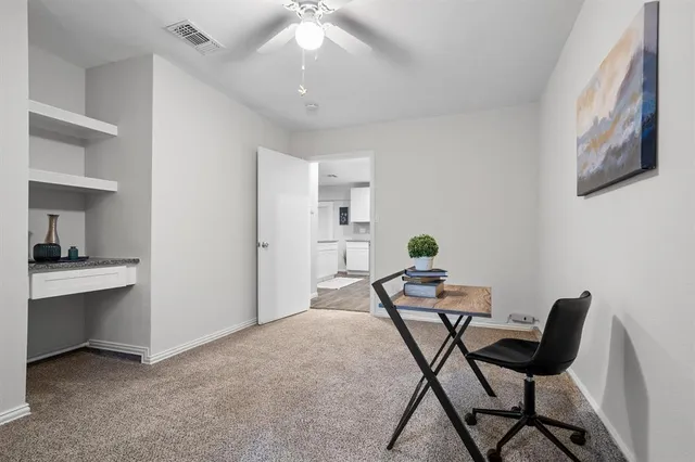 a view of a livingroom with furniture and a chandelier