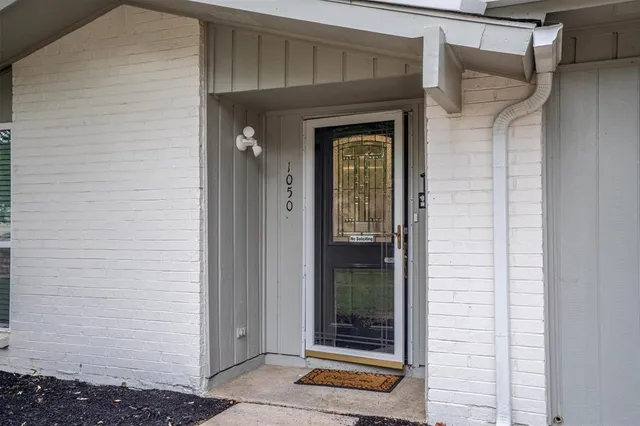 a front view of a house with a glass door