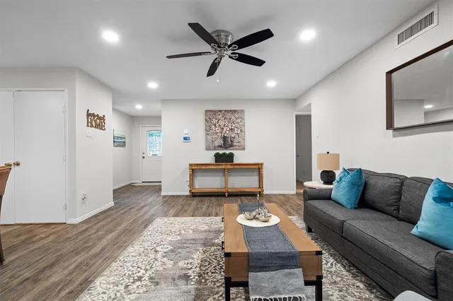 a living room with furniture and a rug