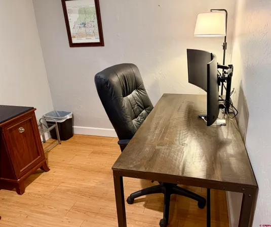a room with furniture and a wooden floor