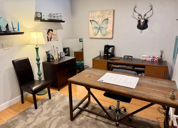 a view of a workspace with furniture