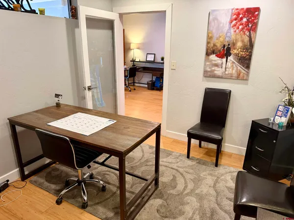 a view of a workspace with furniture