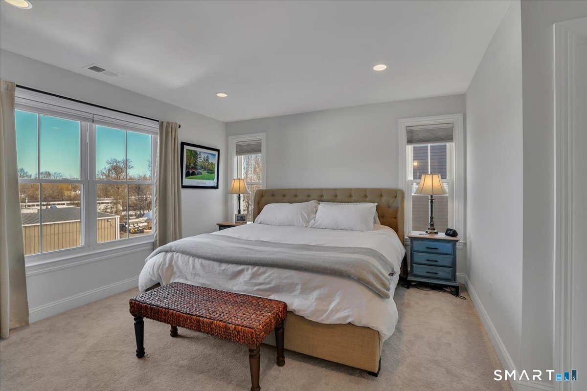 8 Soderman Way, Unit 8 Cheshire, CT 06410 - Photo 14 of 27 a spacious bedroom with a bed and glass door