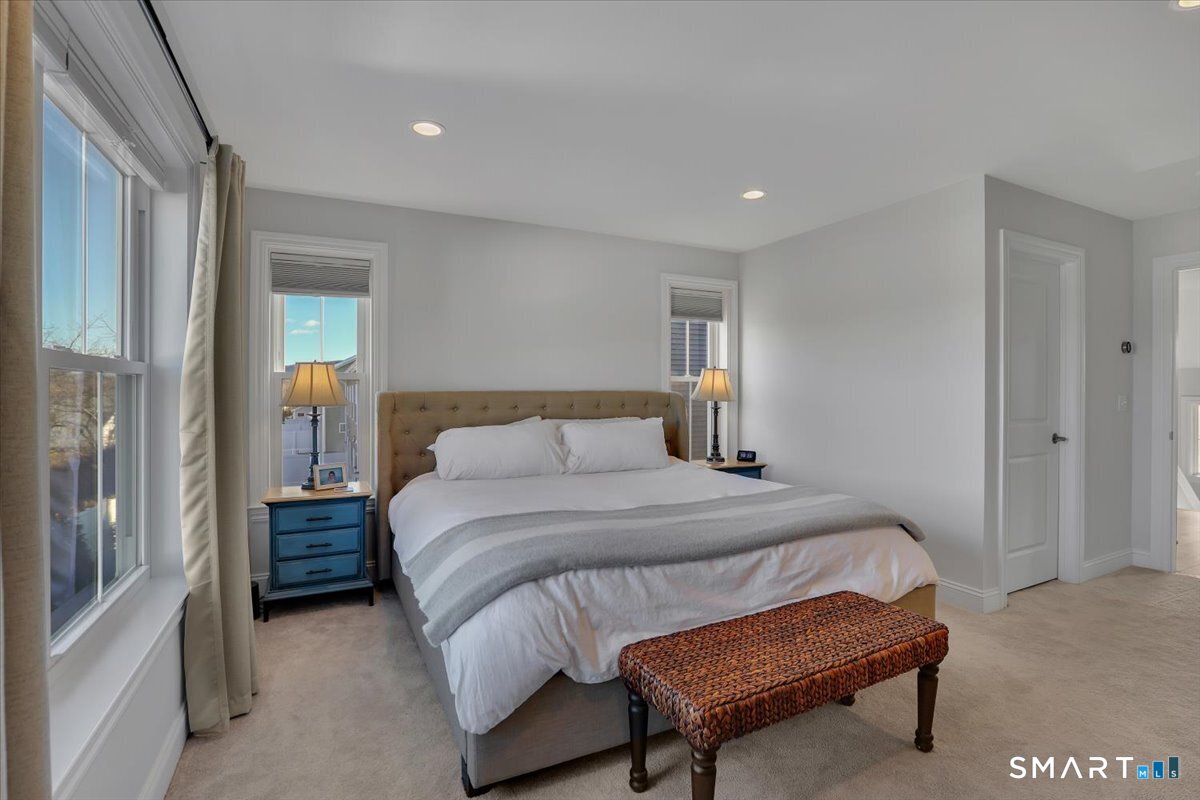 8 Soderman Way, Unit 8 Cheshire, CT 06410 - Photo 15 of 27 a bedroom with a bed and a cabinets