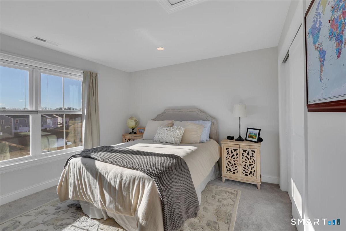 8 Soderman Way, Unit 8 Cheshire, CT 06410 - Photo 18 of 27 a bedroom with a bed and a window