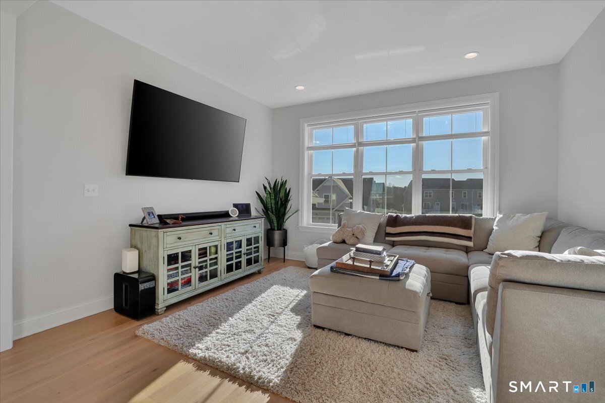 8 Soderman Way, Unit 8 Cheshire, CT 06410 - Photo 2 of 27 a living room with furniture and a flat screen tv