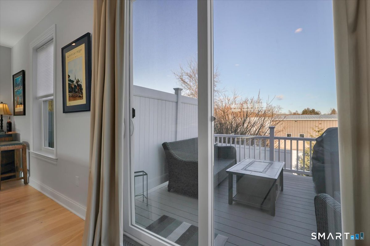 8 Soderman Way, Unit 8 Cheshire, CT 06410 - Photo 21 of 27 a view of a balcony with wooden floor