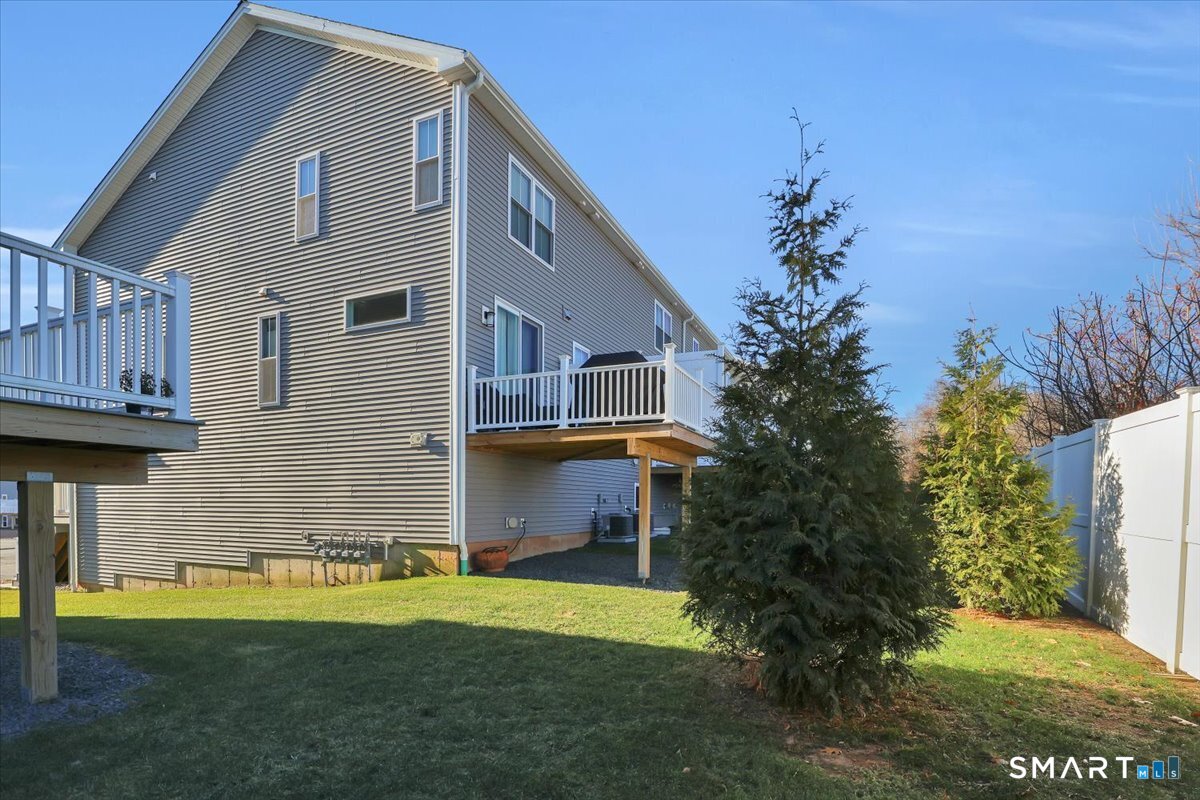 8 Soderman Way, Unit 8 Cheshire, CT 06410 - Photo 22 of 27 a front view of a house with a garden