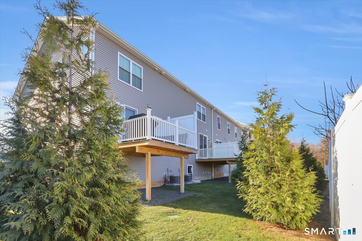 8 Soderman Way, Unit 8 Cheshire, CT 06410 - Photo 23 of 27 a view of a house with a yard and sitting area