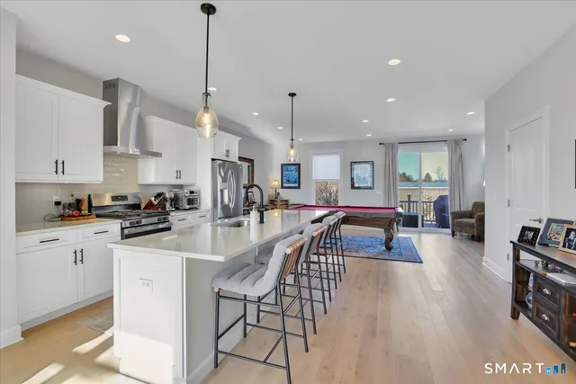 a view of a kitchen and dining room