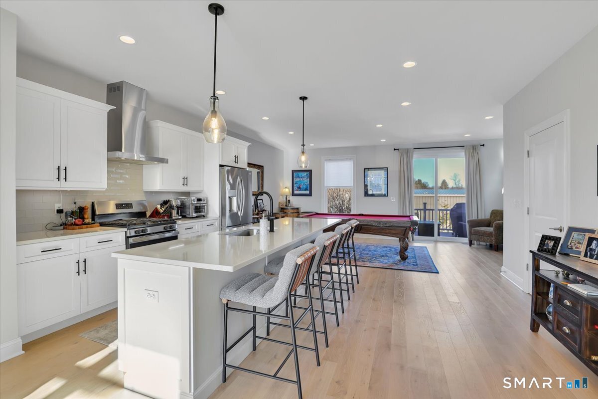 8 Soderman Way, Unit 8 Cheshire, CT 06410 - Photo 6 of 27 a view of a kitchen and dining room