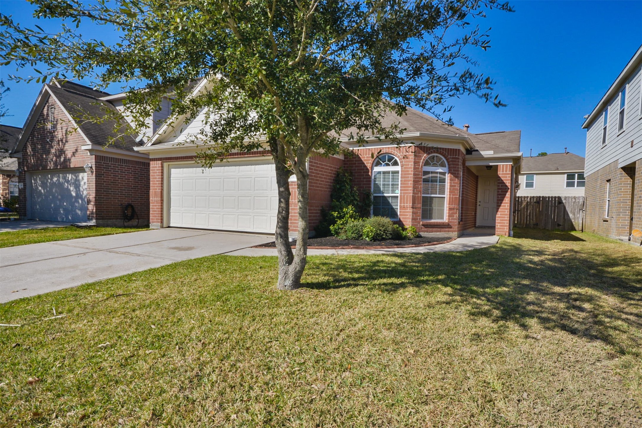 4819 Dappled Grove Trail Humble, TX 77346 - Photo 2 of 20 a front view of a house with garden