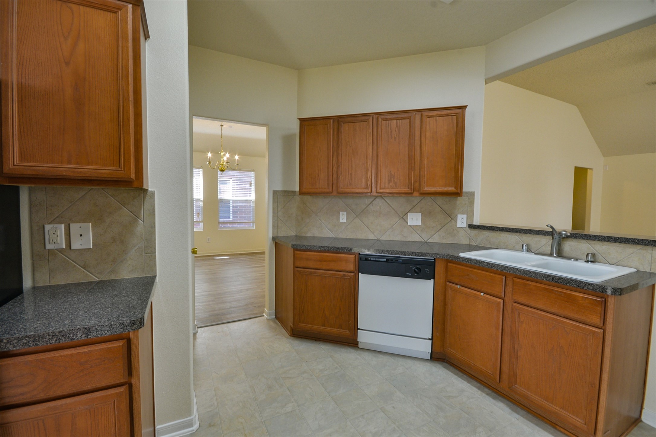 4819 Dappled Grove Trail Humble, TX 77346 - Photo 9 of 20 a kitchen with stainless steel appliances granite countertop a sink stove and cabinets
