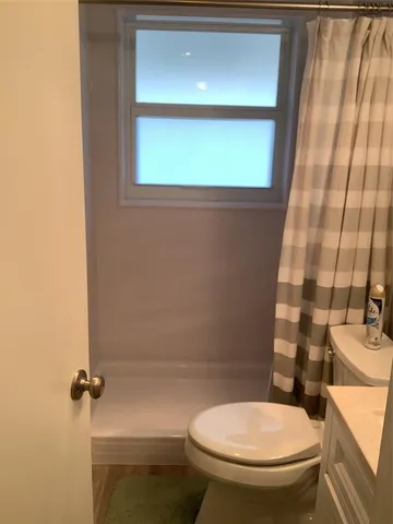 a bathroom with a toilet and a sink