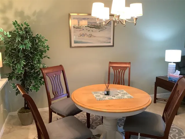 a view of a room with furniture and wooden floor