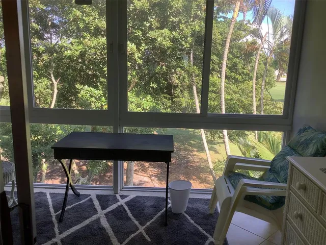 a living room with large windows