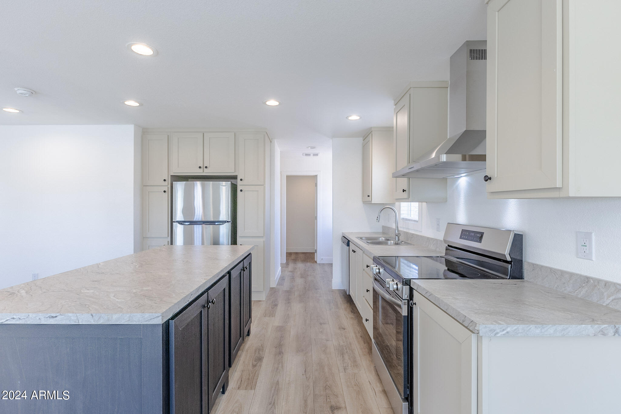 2234 South Descanso Road Apache Junction, AZ 85119 - Photo 9 of 25 a kitchen with stainless steel appliances granite countertop a refrigerator a stove and a sink