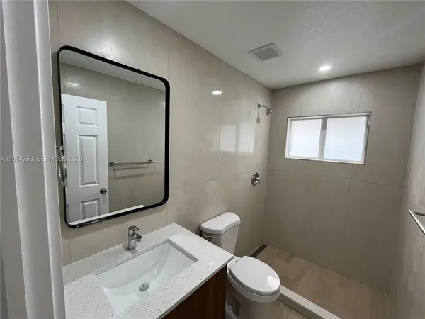 an empty room with wooden floor