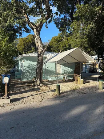 a house with a tree in front of it