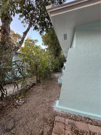 a view of a house with a tree